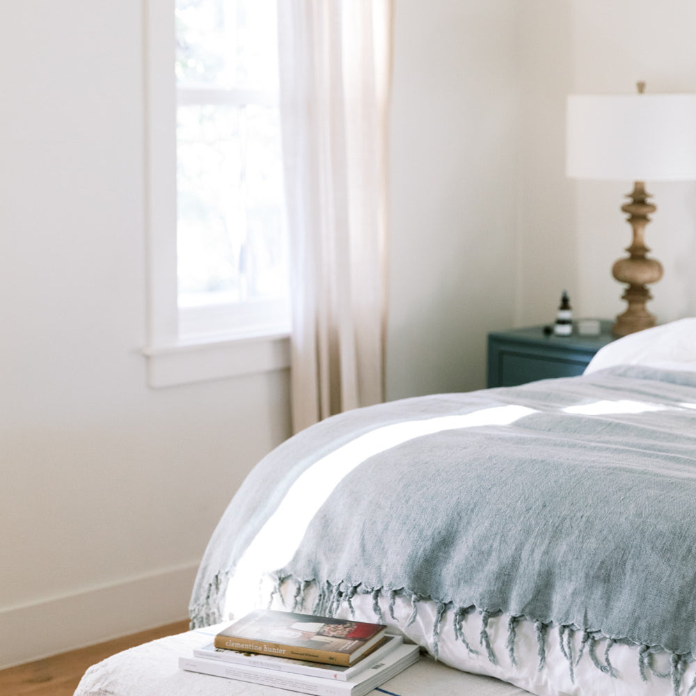 A calm bedroom with beautiful natural light coming through the window